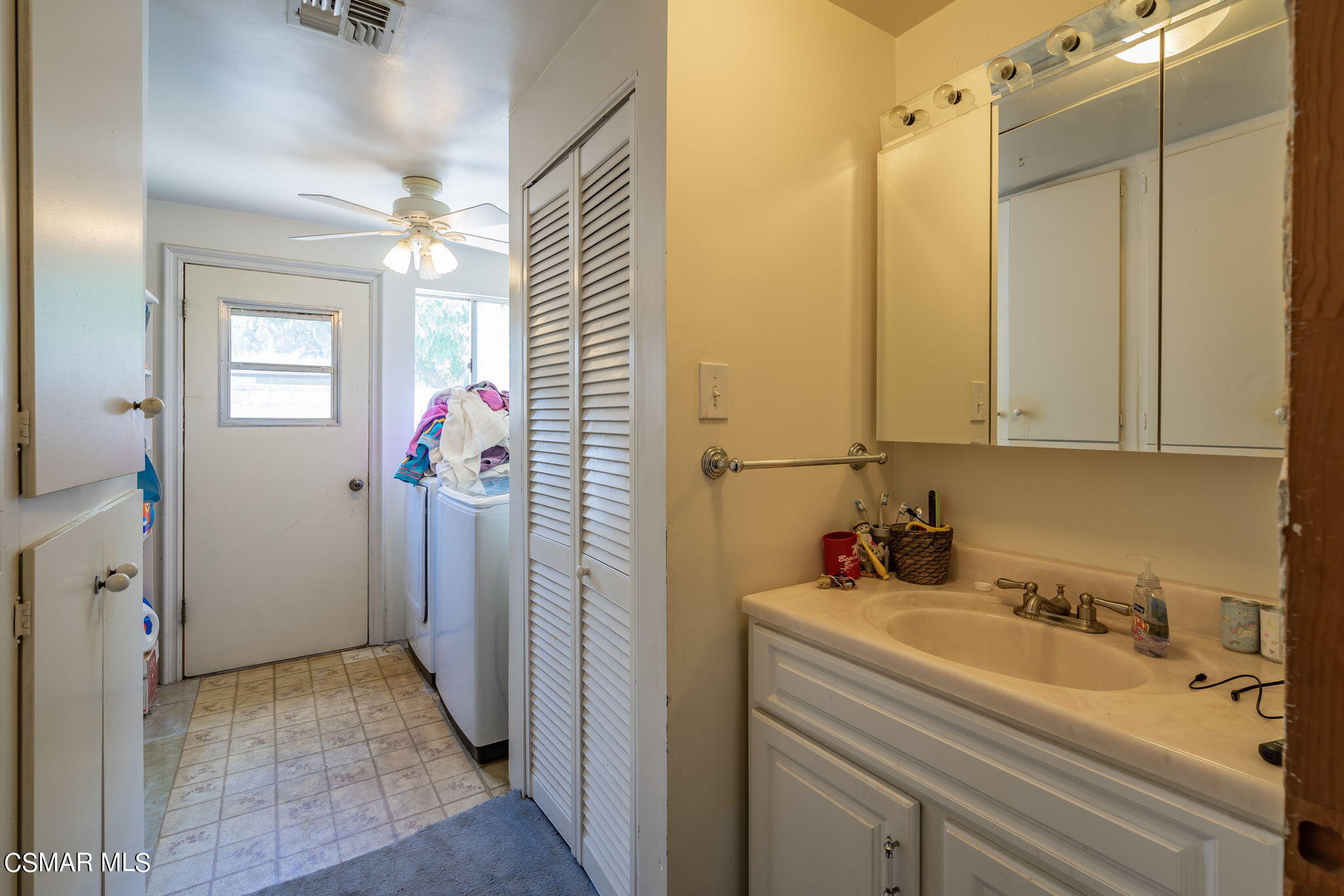 4198 Adam Road Simi Valley, CA 93063 - Photo 11 of 19 a bathroom with a sink and mirror with shower