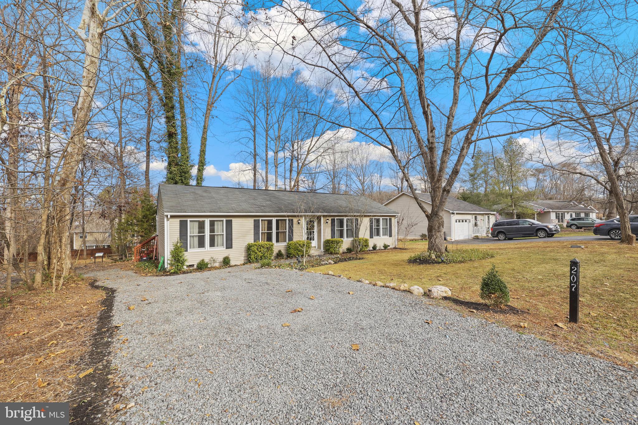 207 Spotswood Road Locust Grove, VA 22508 - Photo 2 of 58 a view of a house with snow on the road