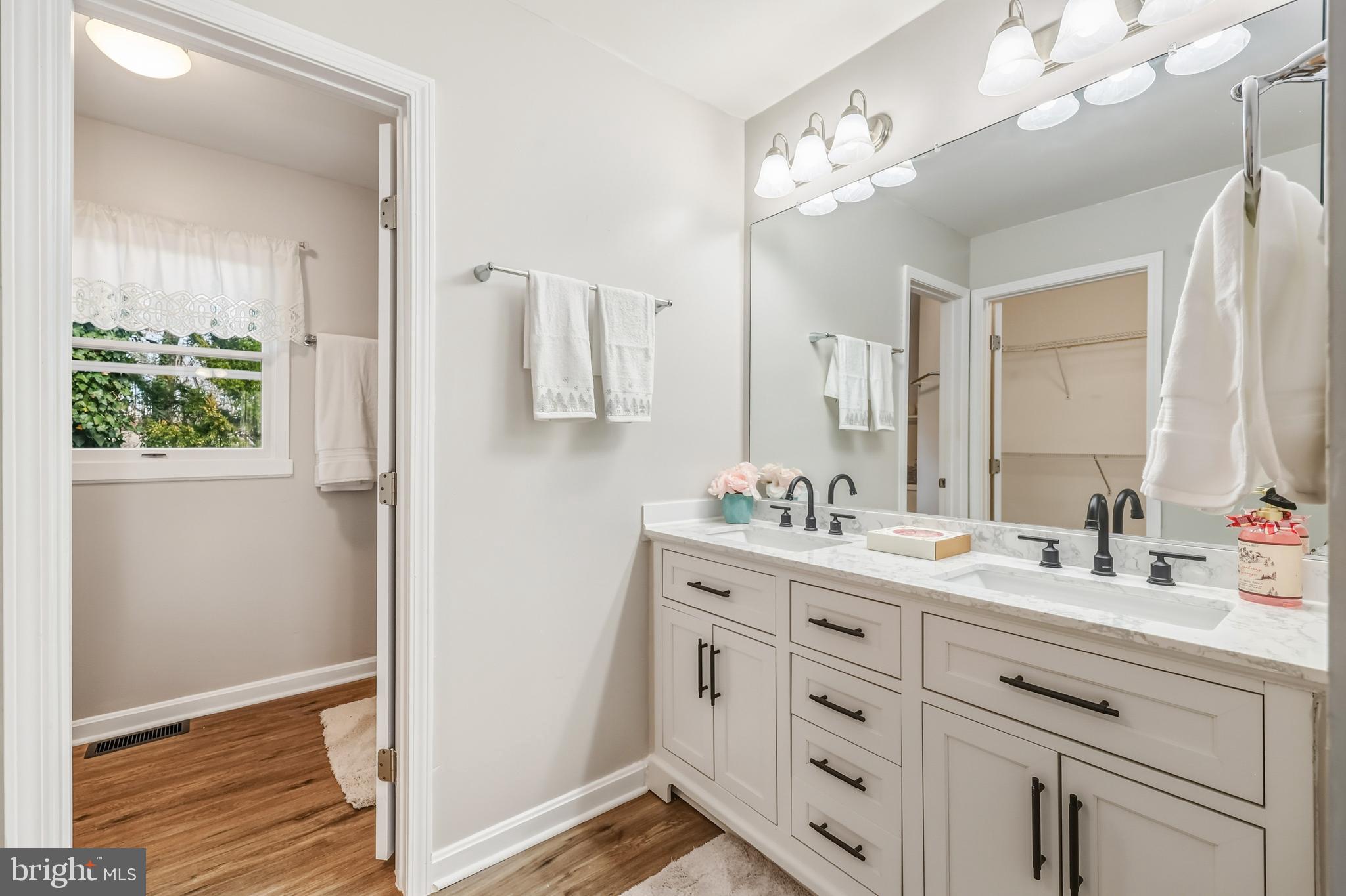 207 Spotswood Road Locust Grove, VA 22508 - Photo 24 of 58 a bathroom with a double vanity sink and mirror