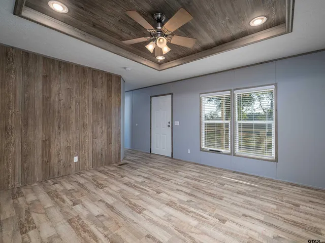 a view of an empty room with a window