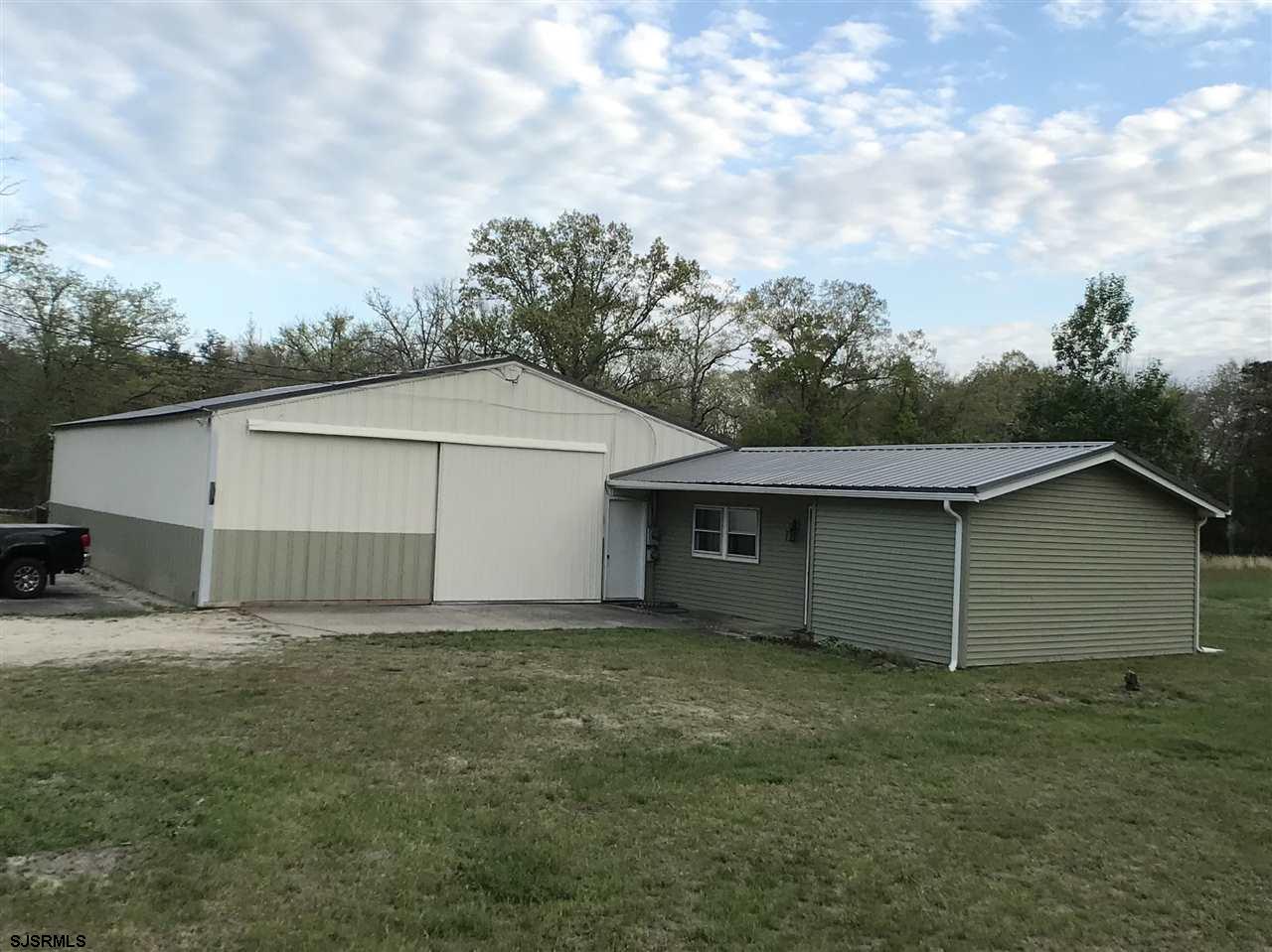 a house with trees in the background