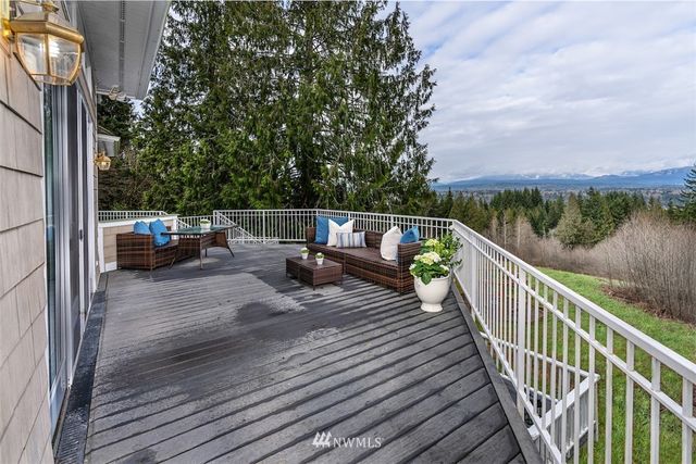 a view of balcony with couches