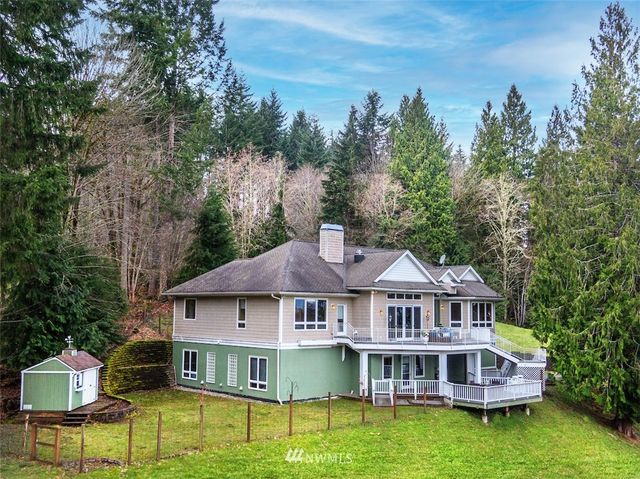 a view of house with outdoor space and seating