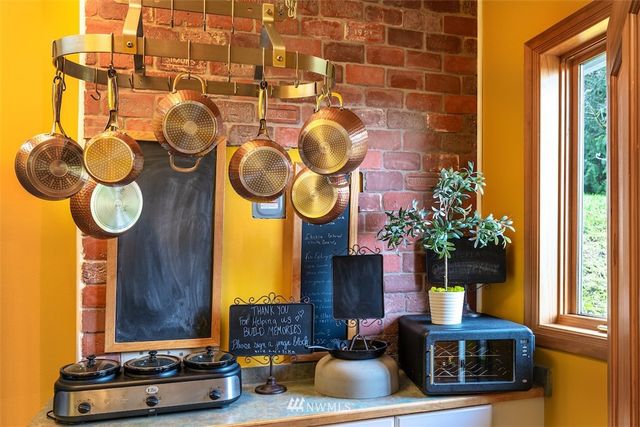 a living room with fireplace furniture and a window