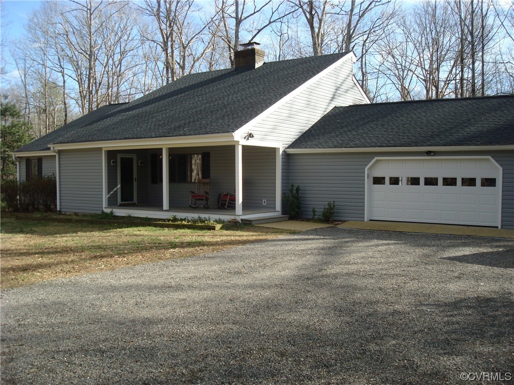 12803 Spring Run Road Chesterfield, VA 23832 - Photo 1 of 40 a front view of a house with a yard and garage