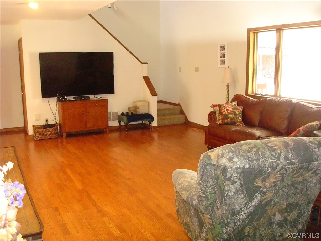12803 Spring Run Road Chesterfield, VA 23832 - Photo 13 of 40 a living room with furniture and a flat screen tv