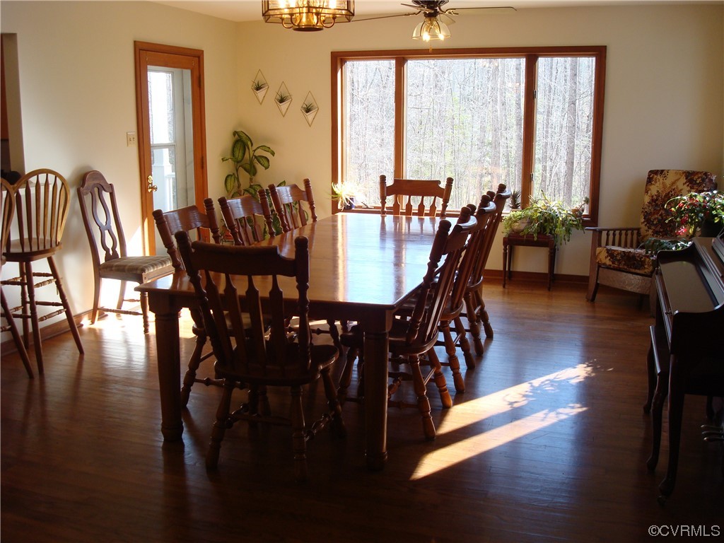 12803 Spring Run Road Chesterfield, VA 23832 - Photo 15 of 40 a view of a dining room with furniture window and wooden floor