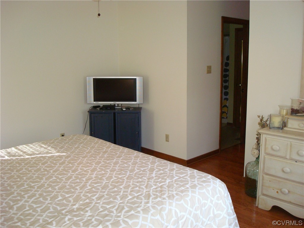 12803 Spring Run Road Chesterfield, VA 23832 - Photo 24 of 40 a bedroom with a bed and a flat tv screen in it
