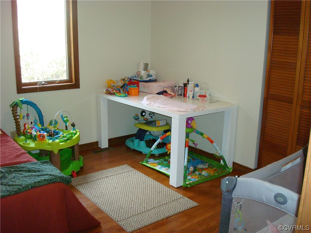 12803 Spring Run Road Chesterfield, VA 23832 - Photo 29 of 40 a bed room with furniture and a wooden floor