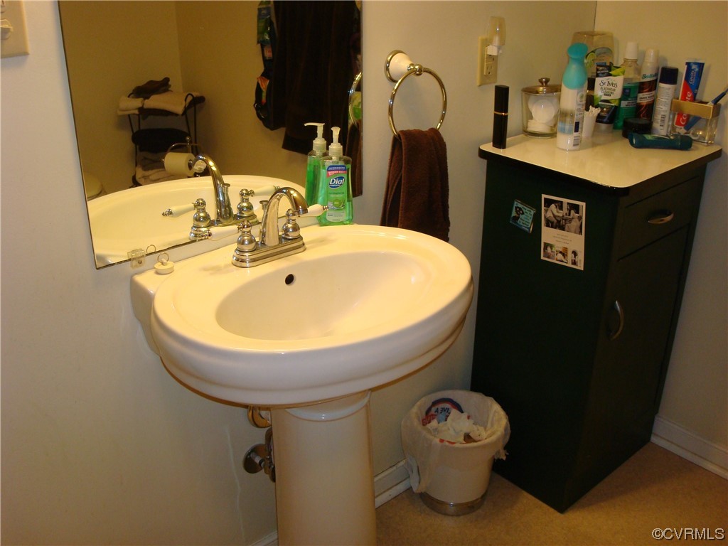 12803 Spring Run Road Chesterfield, VA 23832 - Photo 35 of 40 a bathroom with a sink toilet and mirror