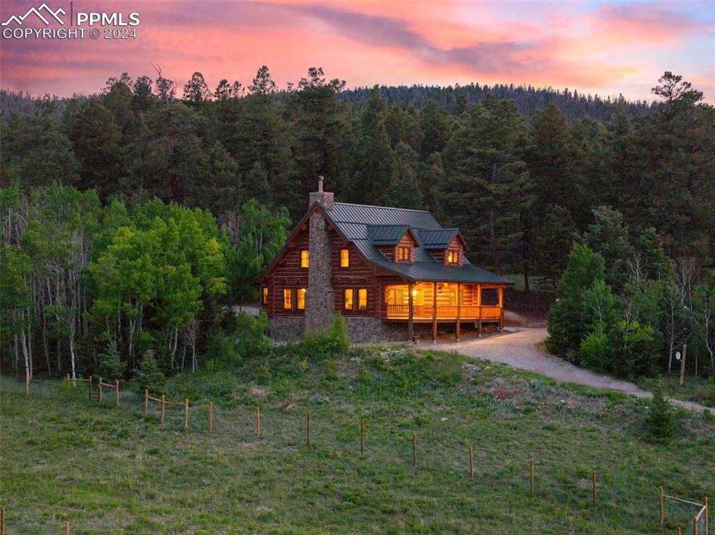 626 Stacker Drive Hartsel, CO 80449 - Photo 15 of 50 a large green field with lots of trees in the background