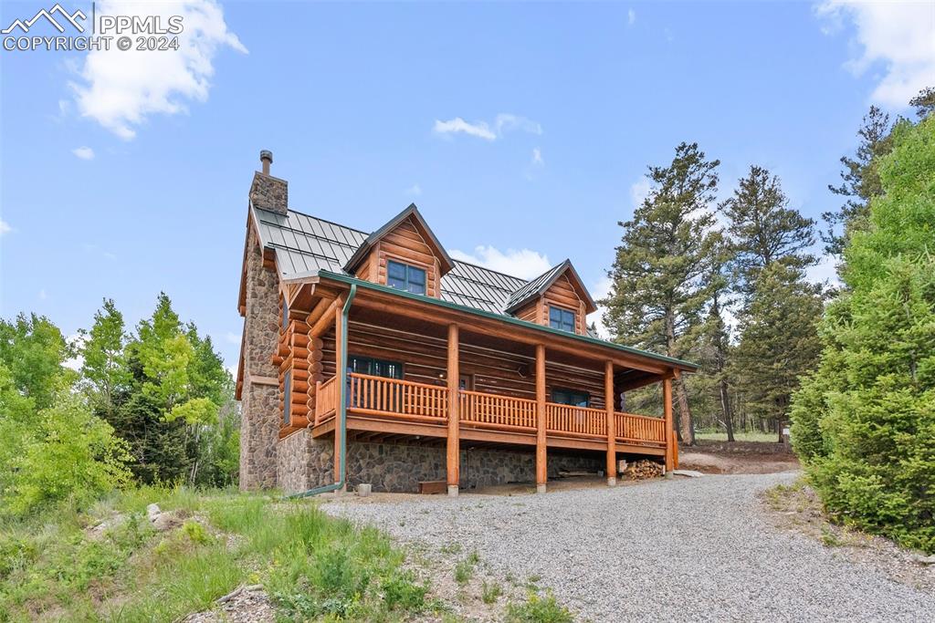 626 Stacker Drive Hartsel, CO 80449 - Photo 19 of 50 a view of a house with a yard and balcony