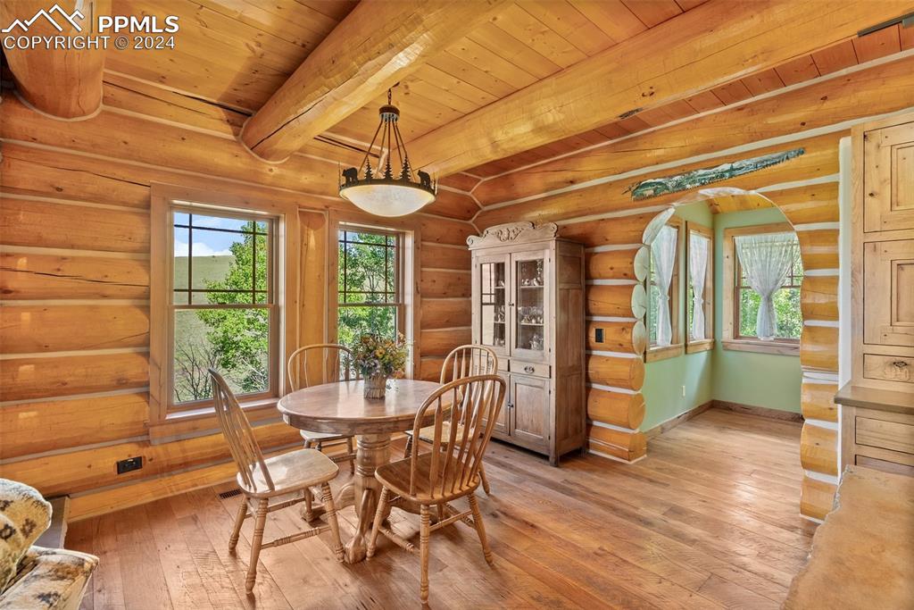 626 Stacker Drive Hartsel, CO 80449 - Photo 33 of 50 a view of a dining room with furniture window and wooden floor