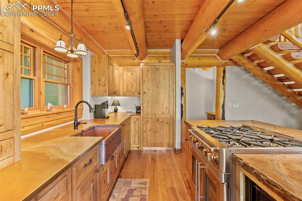 626 Stacker Drive Hartsel, CO 80449 - Photo 35 of 50 a kitchen with a sink stove and cabinets