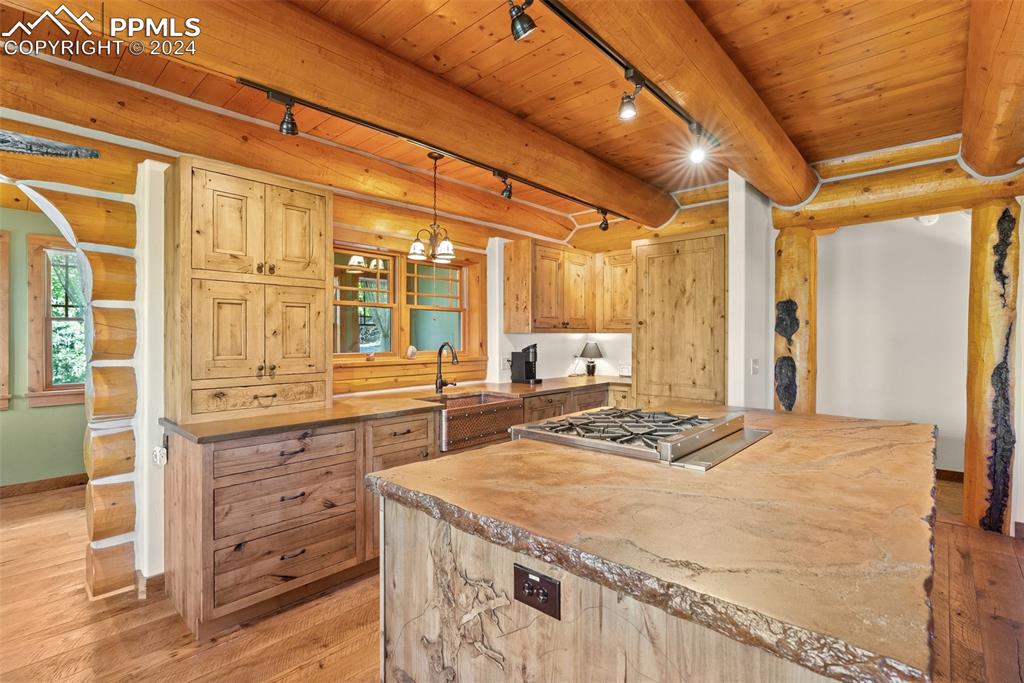 626 Stacker Drive Hartsel, CO 80449 - Photo 36 of 50 a kitchen with a stove a sink and a refrigerator