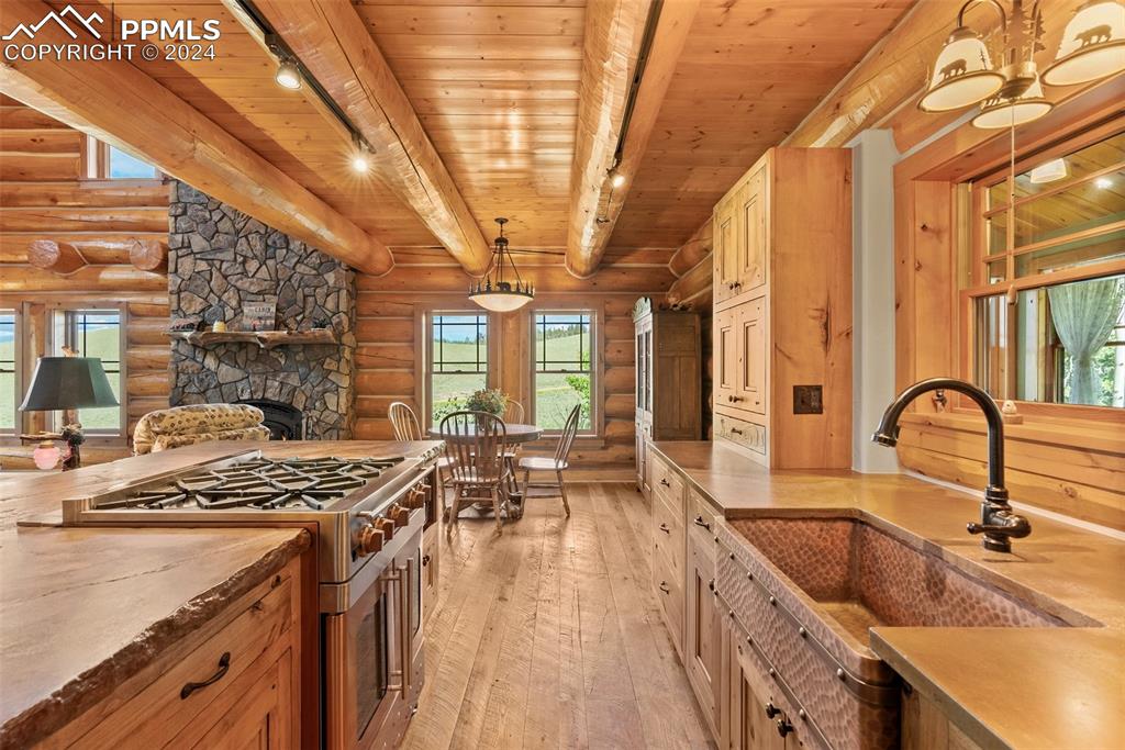 626 Stacker Drive Hartsel, CO 80449 - Photo 38 of 50 a kitchen with sink a stove and cabinets