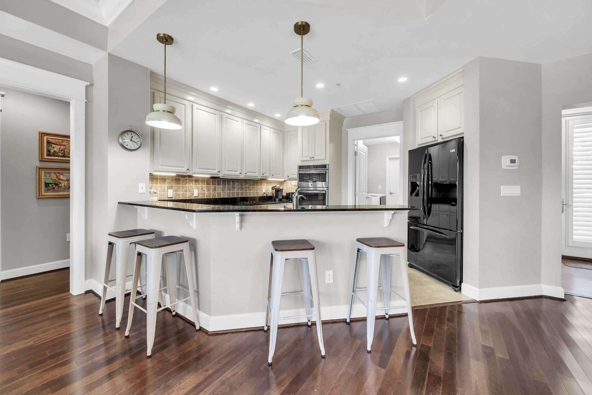 5360 Pine Ridge Lane, Unit 5360 Miramar Beach, FL 32550 - Photo 16 of 44 a kitchen with kitchen island white cabinets and stainless steel appliances
