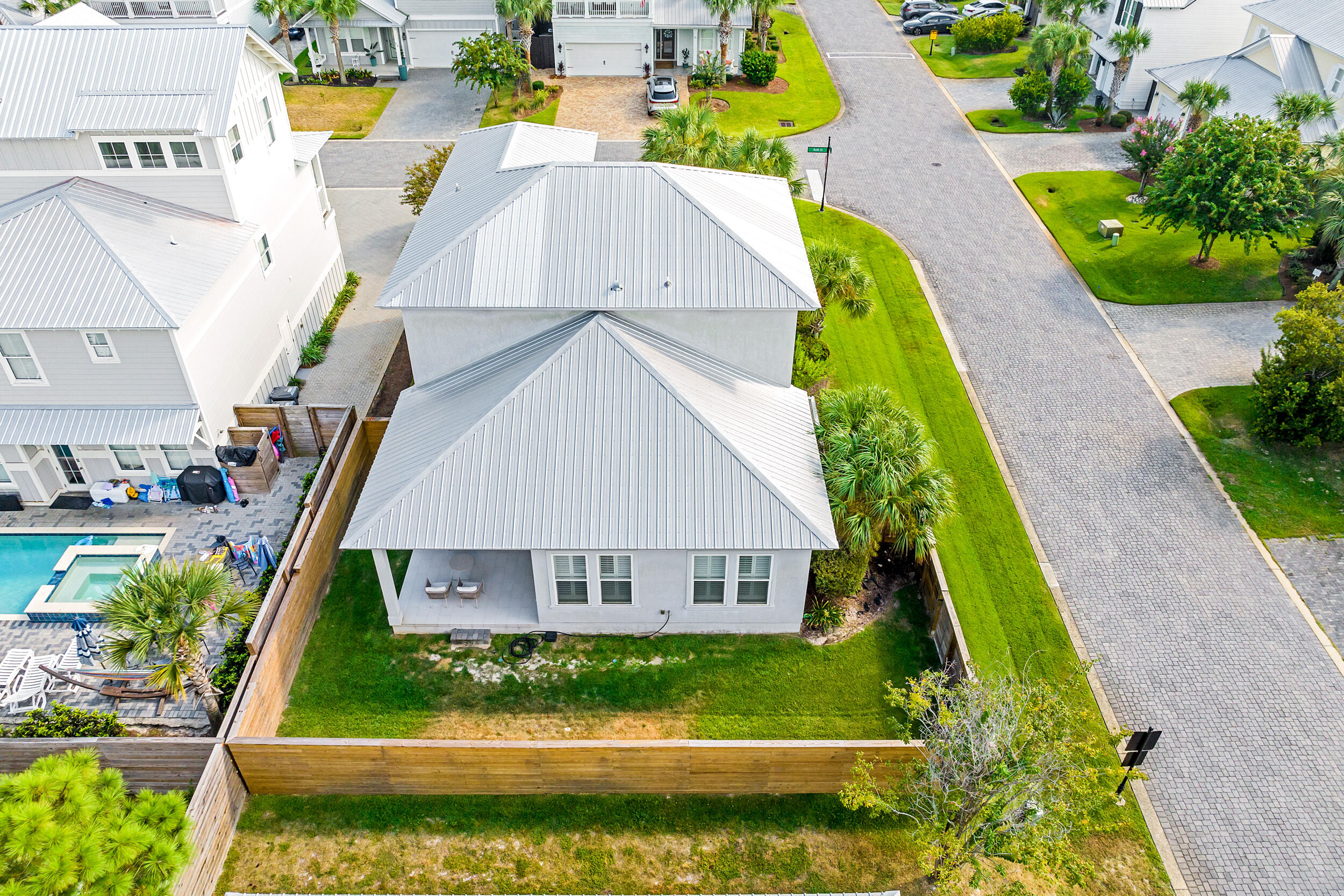 70 Ruth Street Miramar Beach, FL 32550 - Photo 42 of 50 a view of swimming pool with a garden and plants