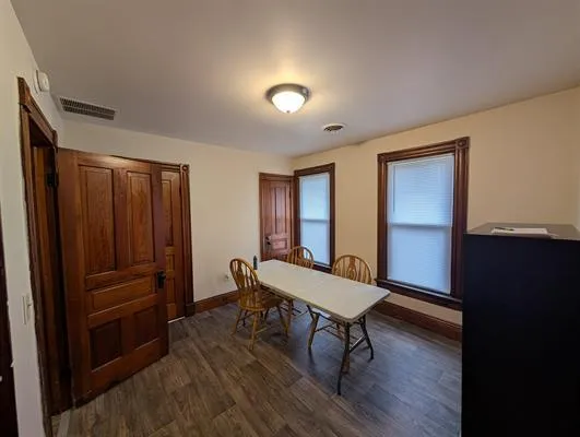 a room with furniture and wooden floor