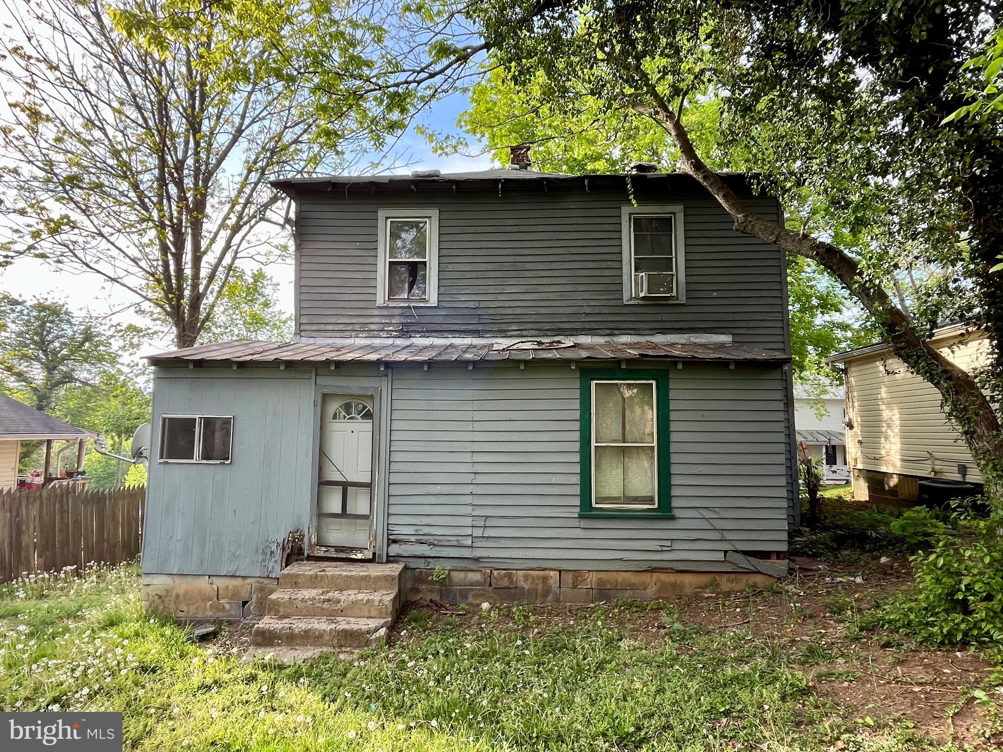 407 Carruthers Street Lexington, VA 24450 - Photo 25 of 29 a front view of a house with garden