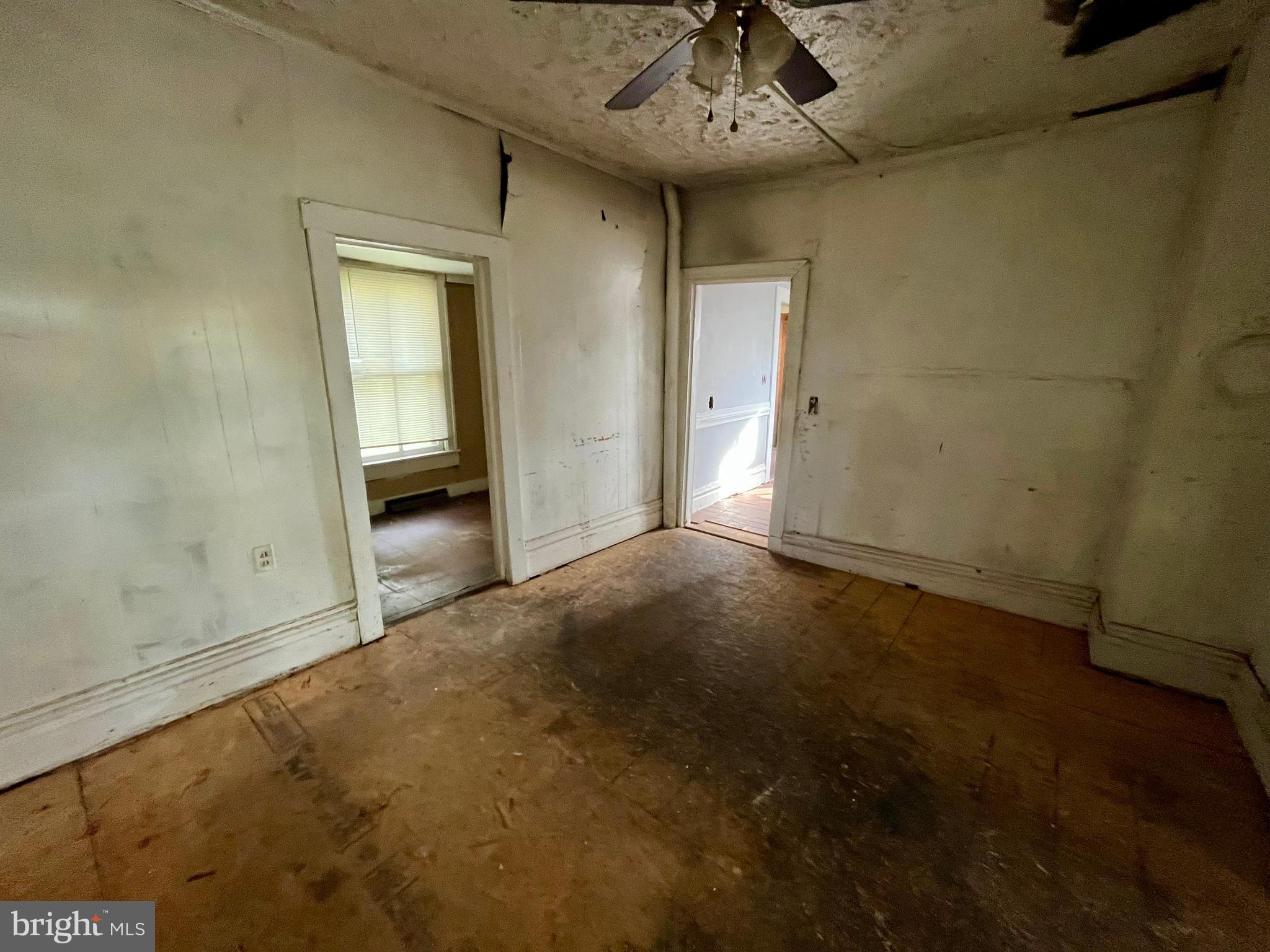 407 Carruthers Street Lexington, VA 24450 - Photo 6 of 29 a view of an empty room and chandelier fan
