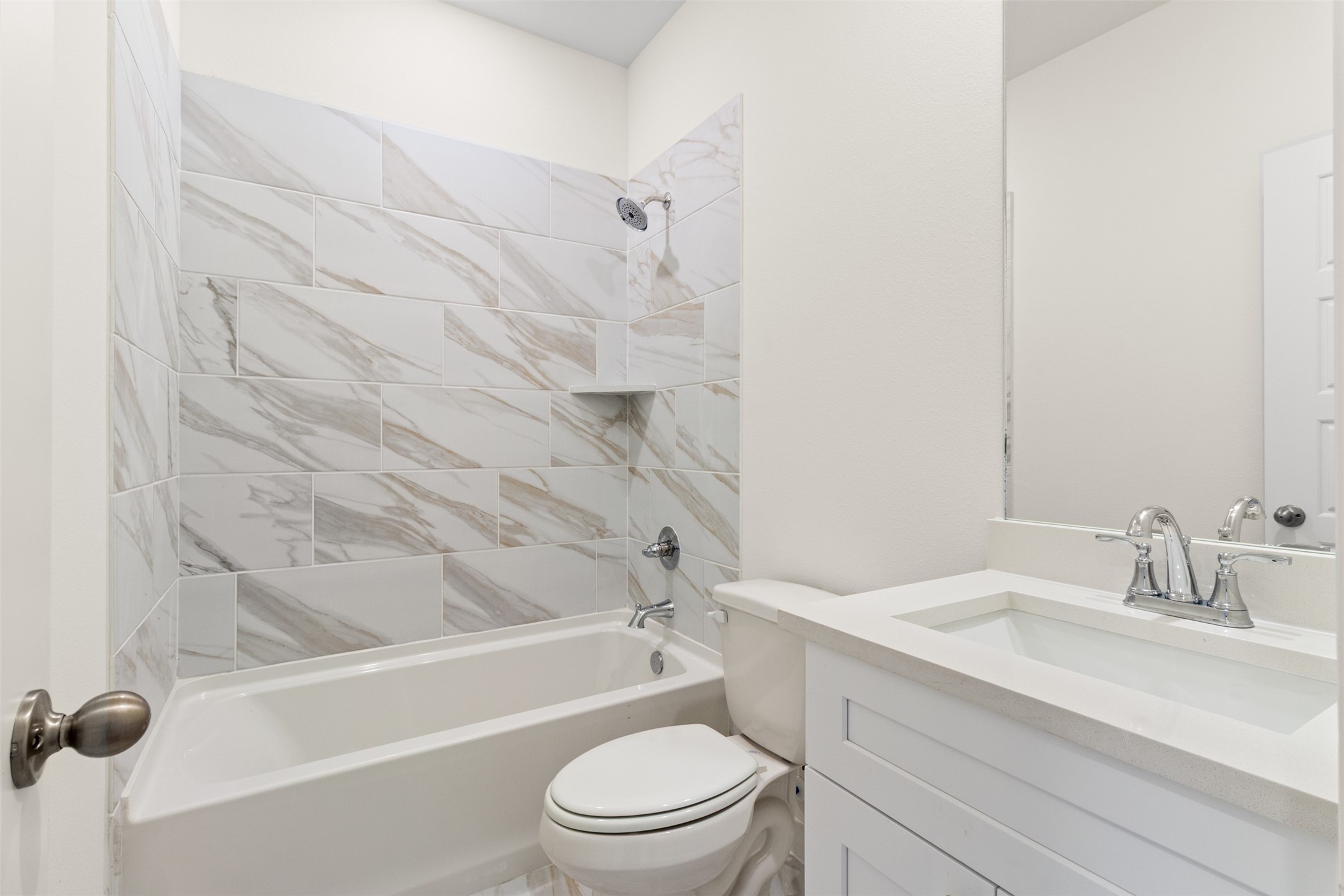 6643 Escondido Drive Rosharon, TX 77583 - Photo 19 of 25 a bathroom with a granite countertop bathtub shower sink vanity and toilet