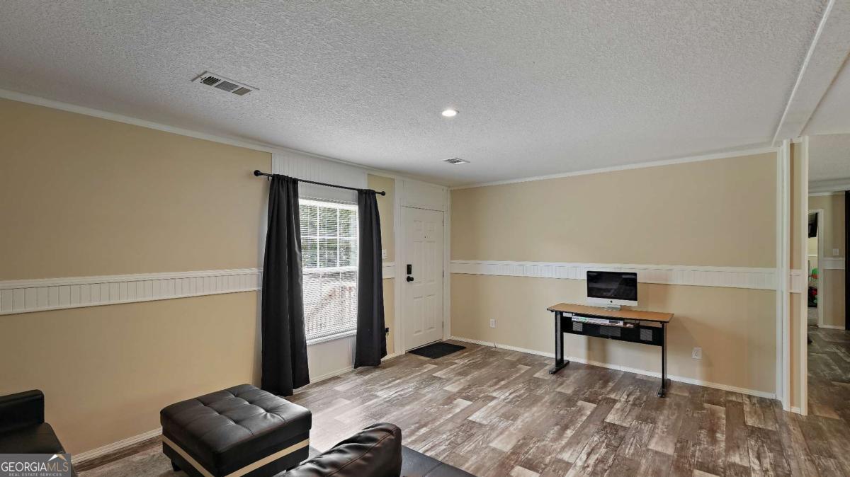64 Sierra Road Jesup, GA 31545 - Photo 7 of 22 a bedroom with a bed and a window