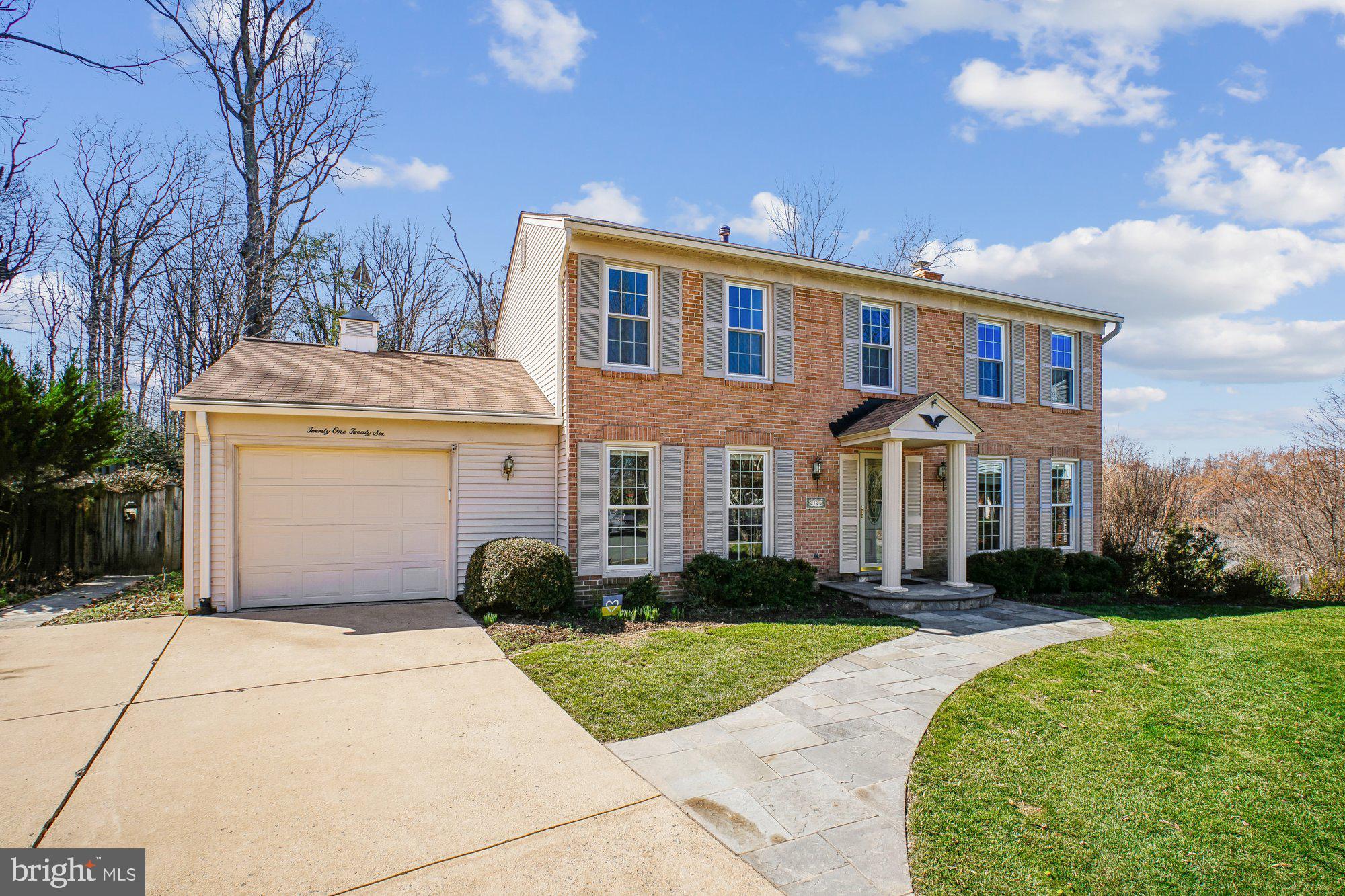 2126 Docket Lane Vienna, VA 22181 - Photo 1 of 63 a front view of a house with garden