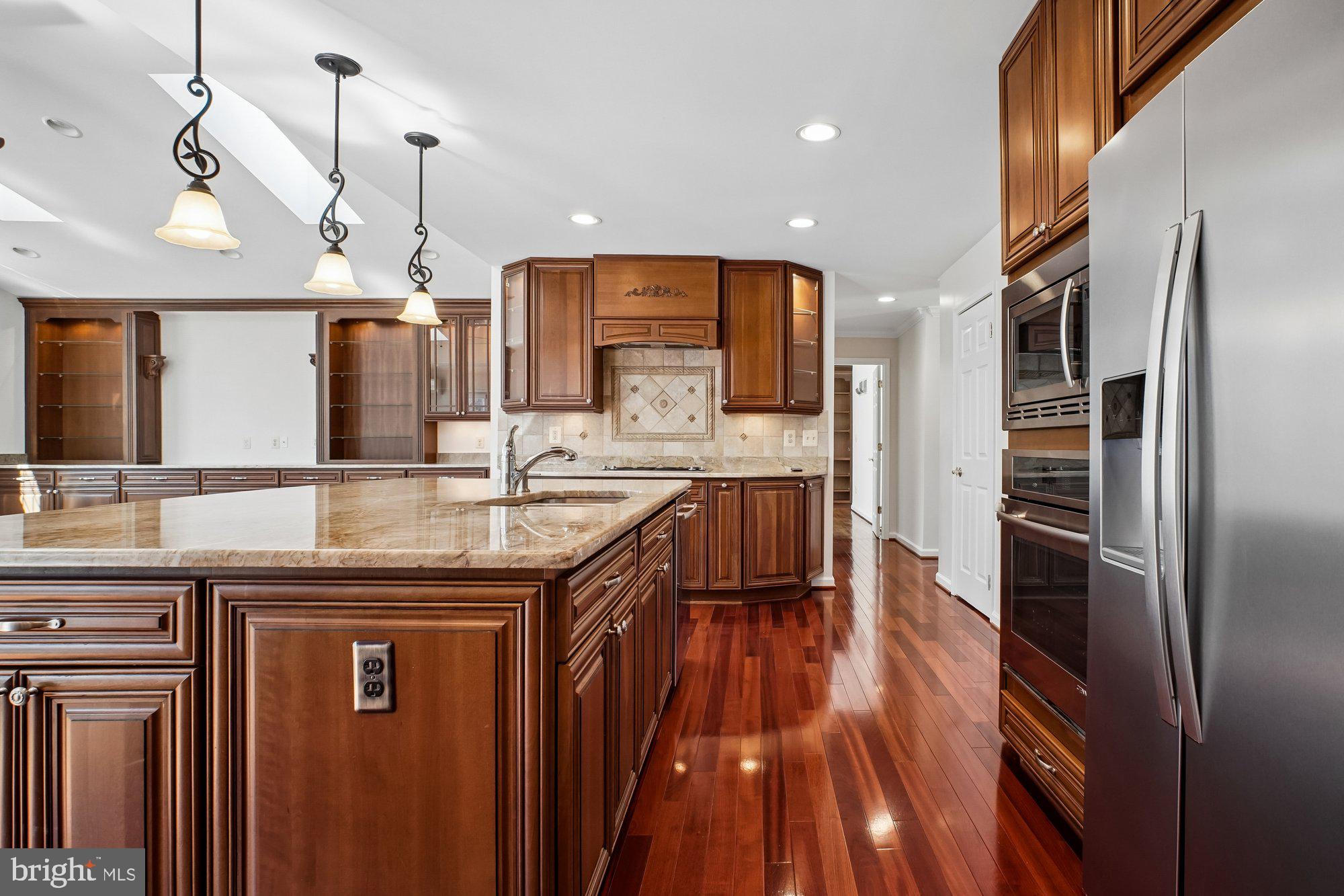 2126 Docket Lane Vienna, VA 22181 - Photo 13 of 63 a kitchen with stainless steel appliances granite countertop a refrigerator a sink and a stove