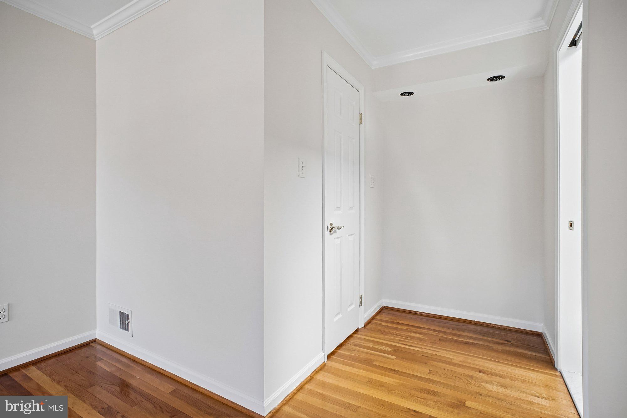 2126 Docket Lane Vienna, VA 22181 - Photo 28 of 63 a view of a room with wooden floor and closet