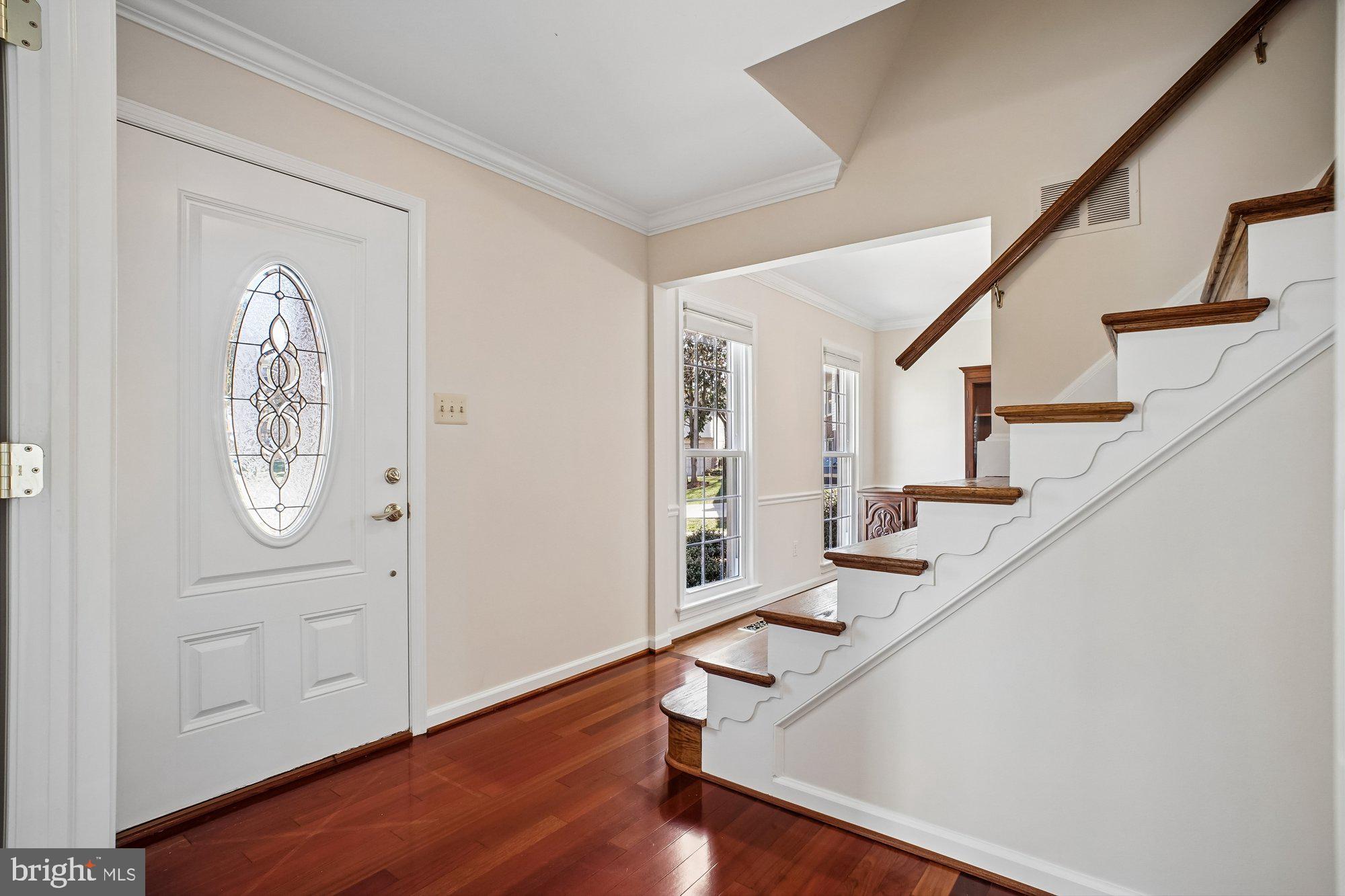 2126 Docket Lane Vienna, VA 22181 - Photo 3 of 63 a view of entryway with wooden floor and stairs