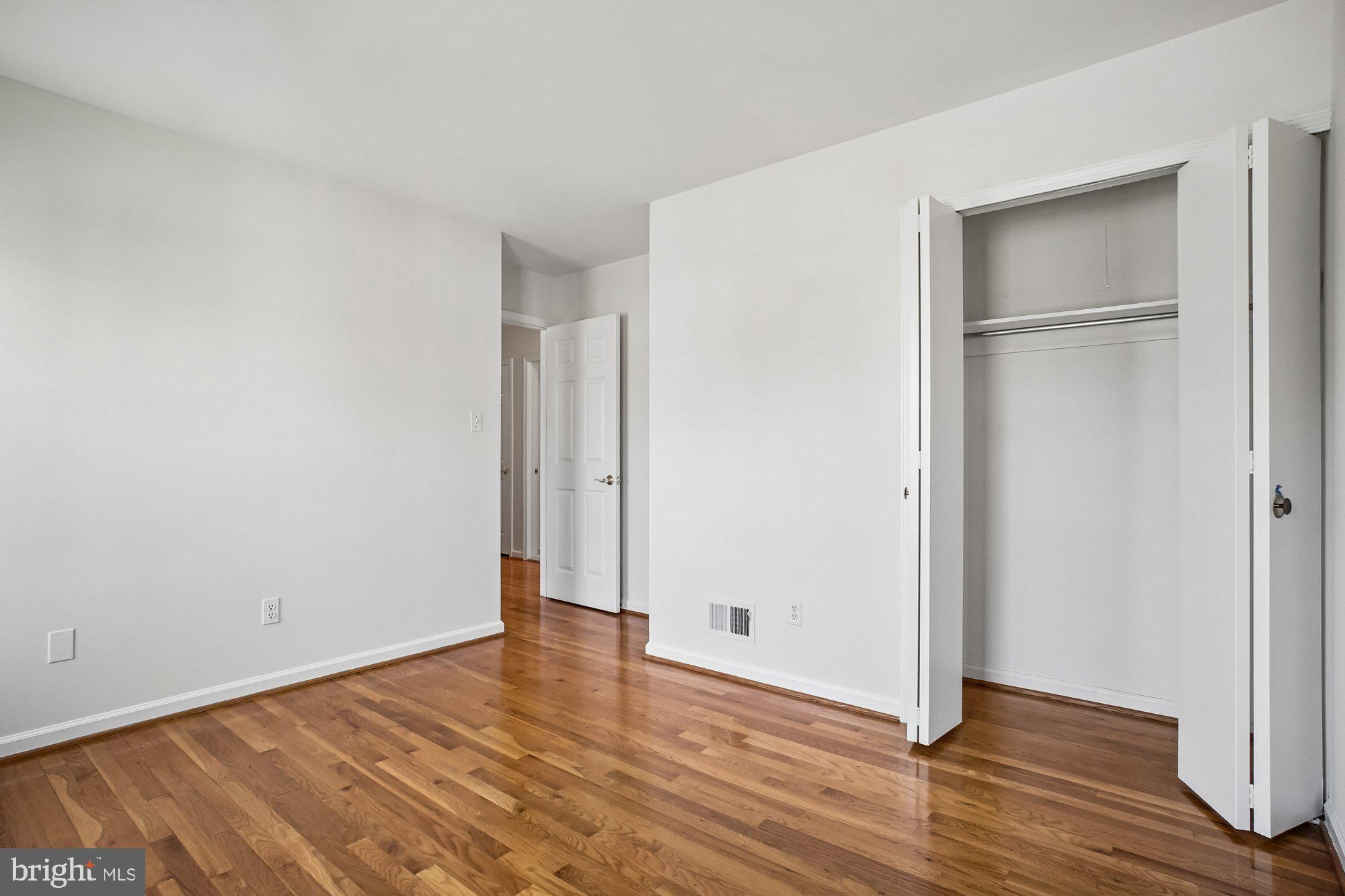 2126 Docket Lane Vienna, VA 22181 - Photo 36 of 63 a view of an empty room with wooden floor
