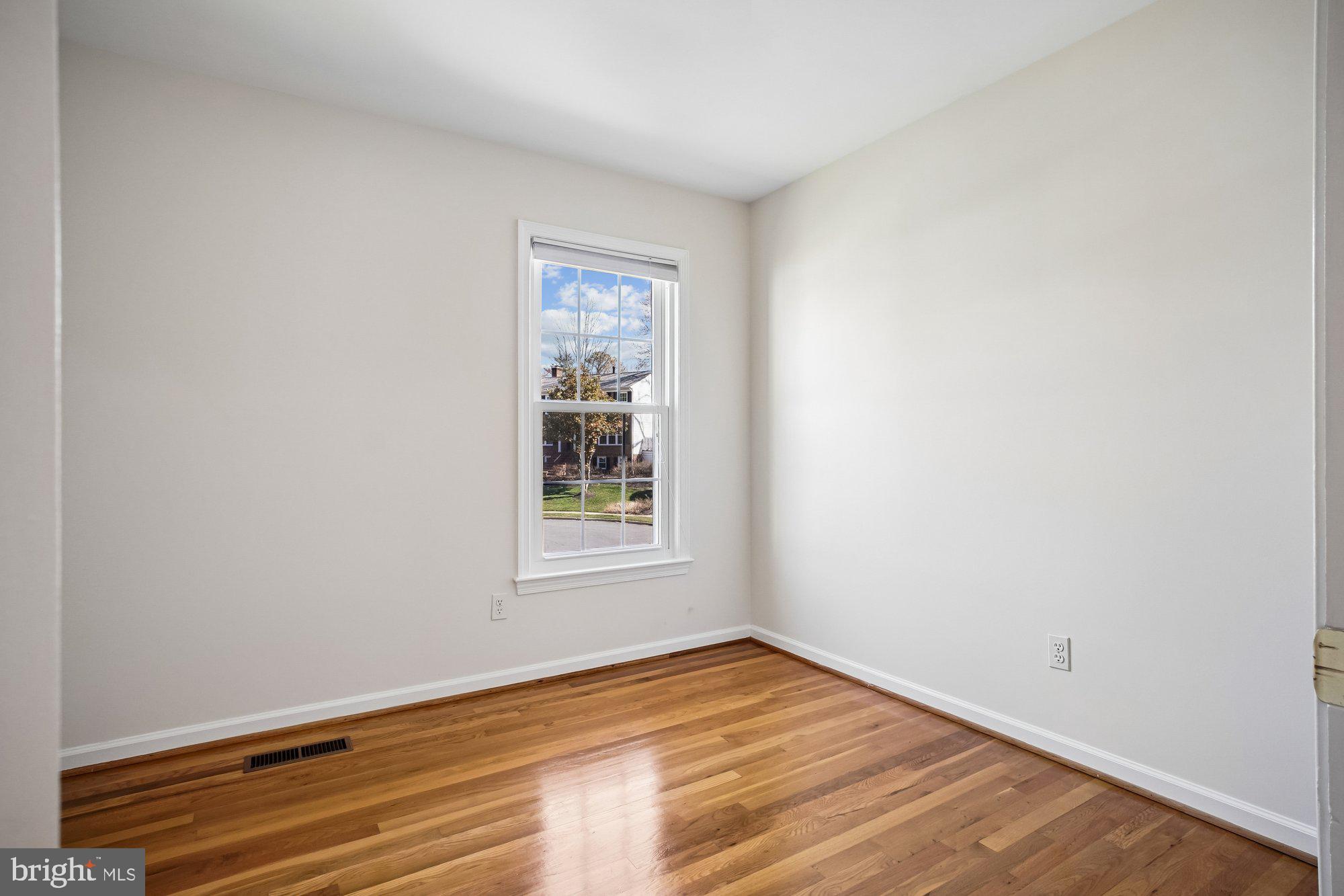 2126 Docket Lane Vienna, VA 22181 - Photo 39 of 63 an empty room with wooden floor and windows