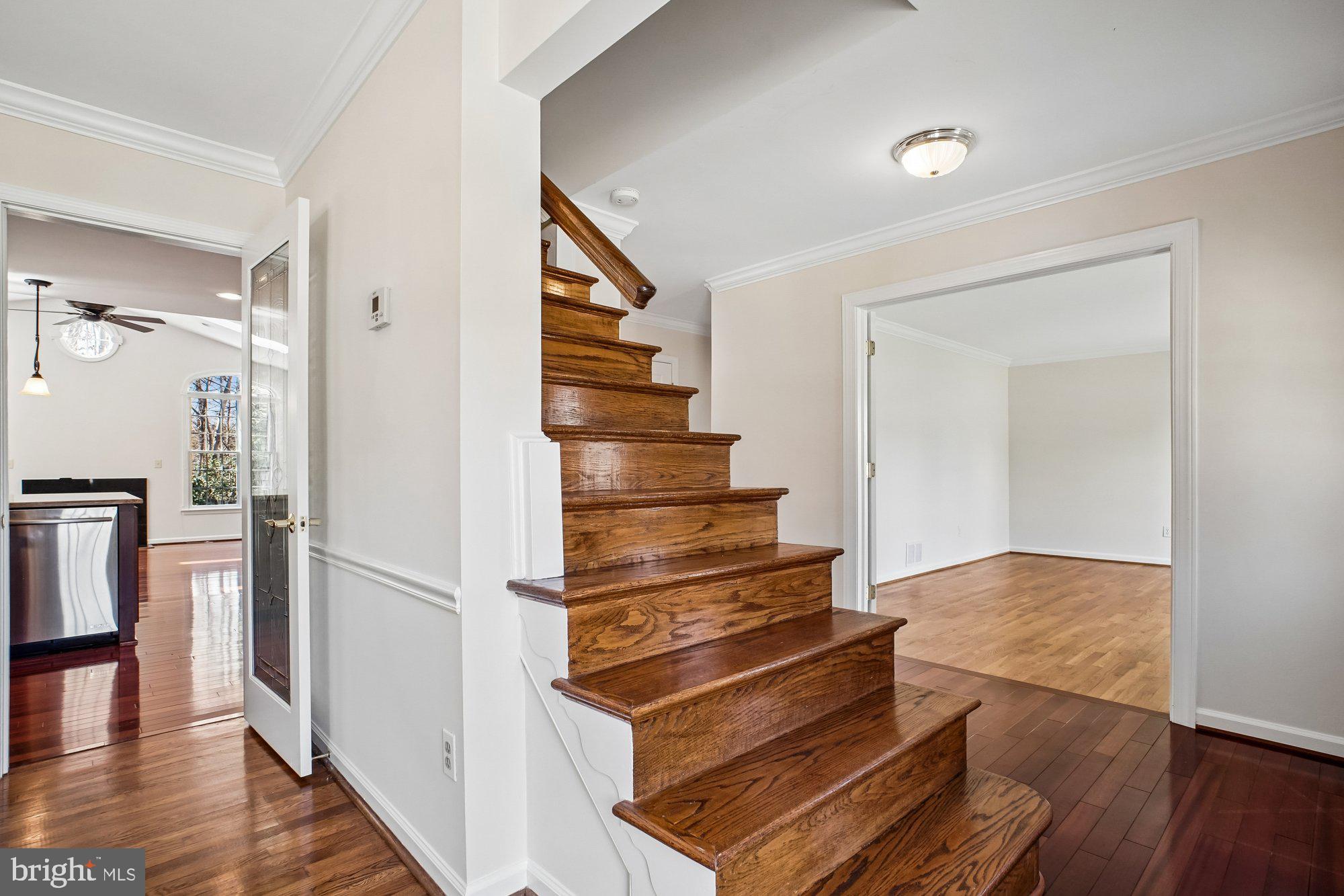 2126 Docket Lane Vienna, VA 22181 - Photo 4 of 63 a view of entryway and hall with wooden floor