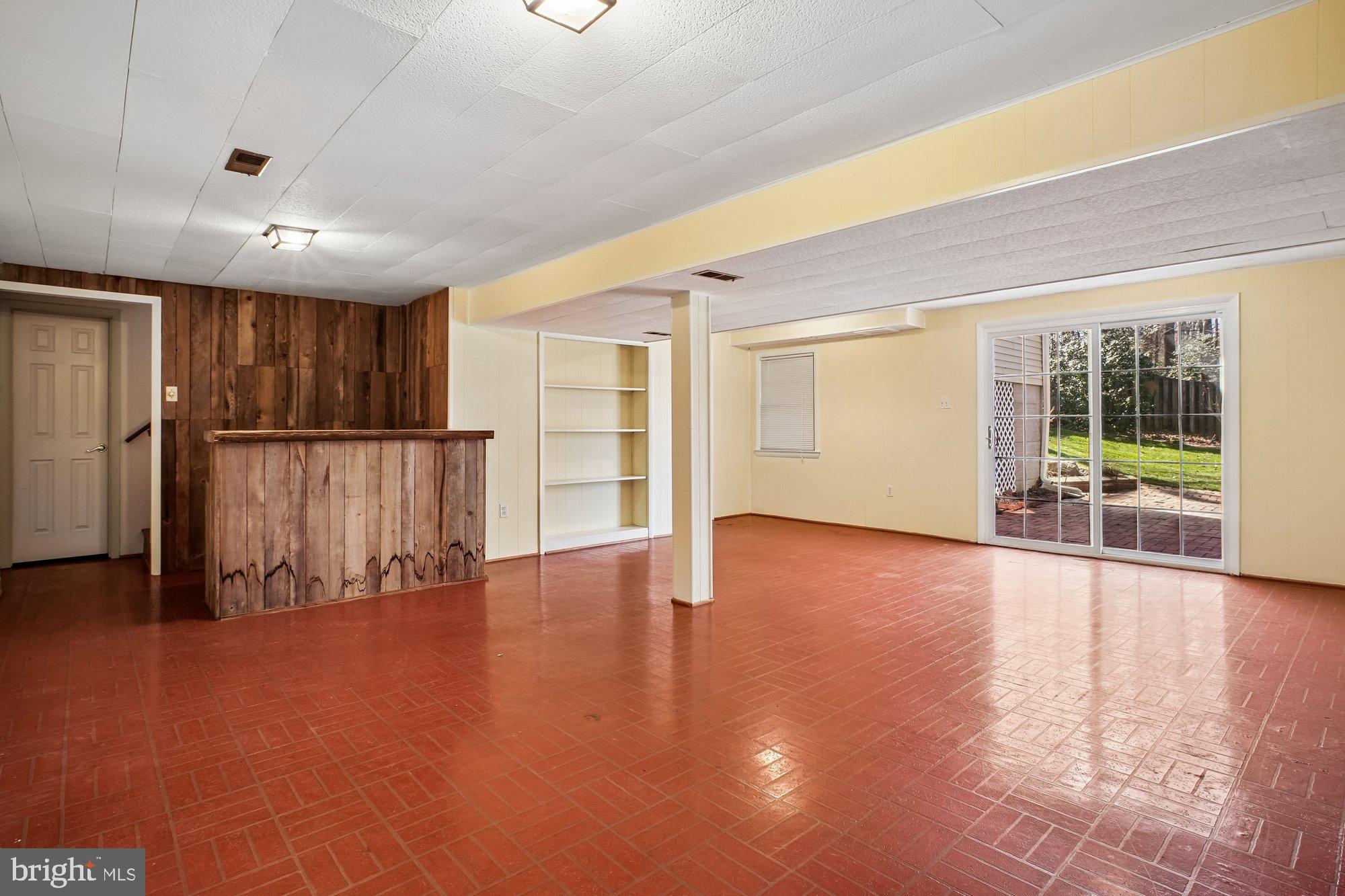 2126 Docket Lane Vienna, VA 22181 - Photo 41 of 63 a view of an empty room with wooden floor and a window