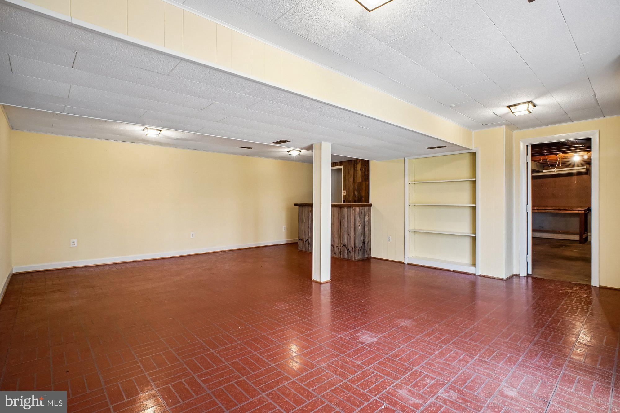 2126 Docket Lane Vienna, VA 22181 - Photo 42 of 63 a view of an empty room with a window and wooden floor