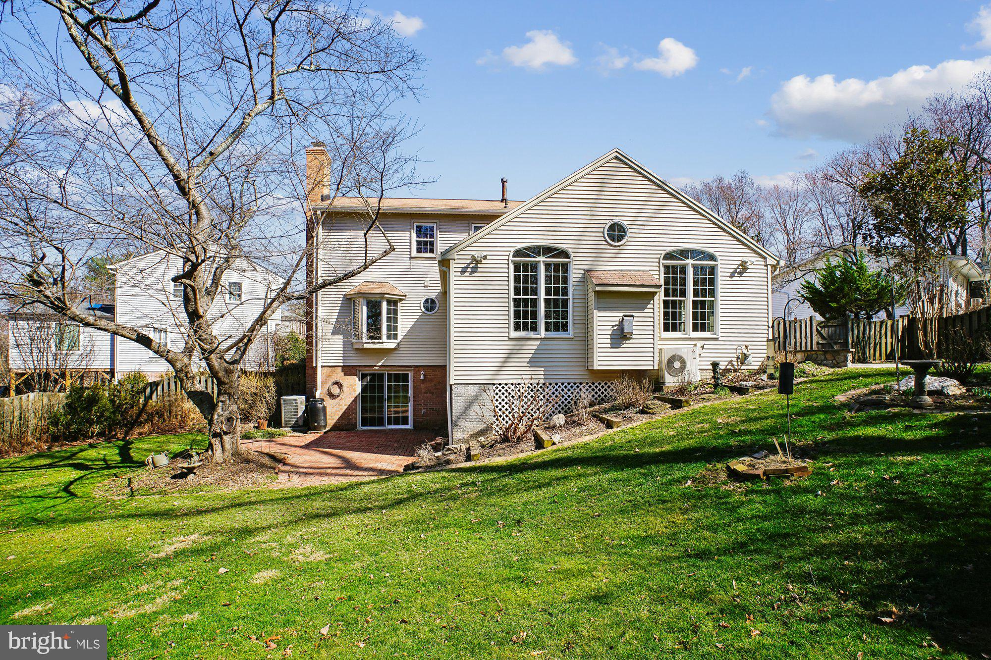 2126 Docket Lane Vienna, VA 22181 - Photo 50 of 63 a view of a house with a yard