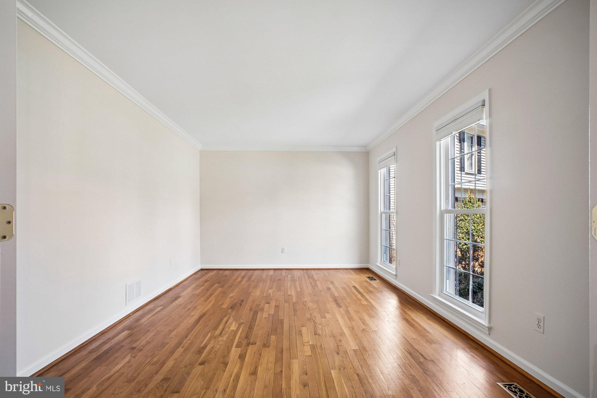 2126 Docket Lane Vienna, VA 22181 - Photo 5 of 63 a view of a room with wooden floor and a window
