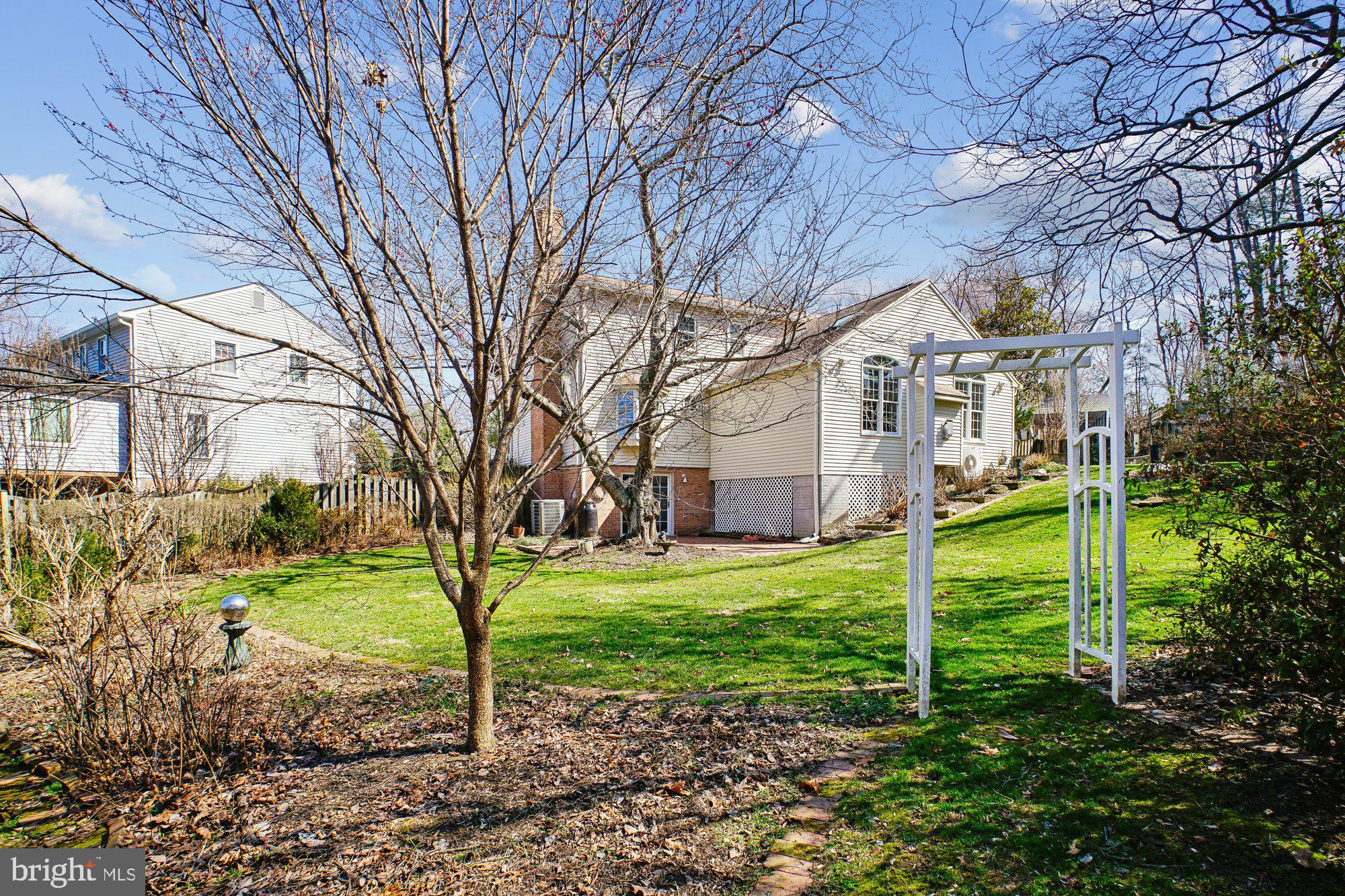2126 Docket Lane Vienna, VA 22181 - Photo 51 of 63 a view of a house with a yard