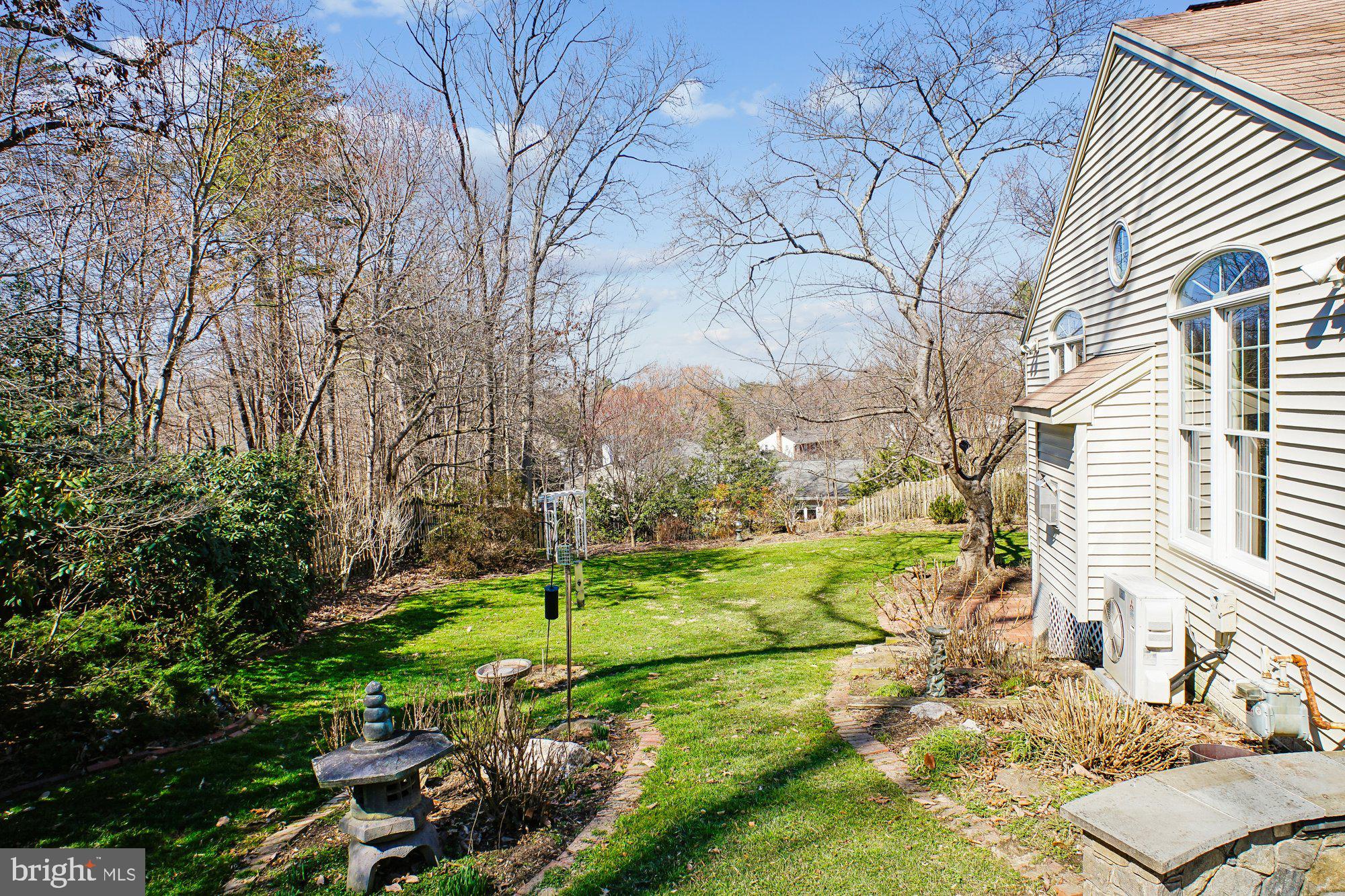 2126 Docket Lane Vienna, VA 22181 - Photo 52 of 63 a view of a backyard with table and chairs and potted plants