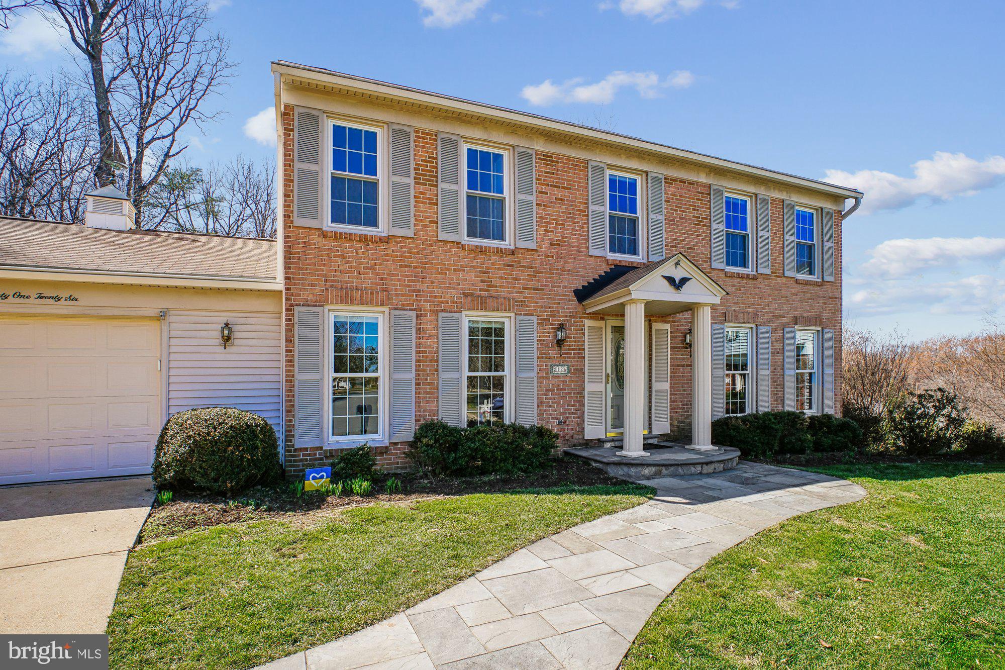 2126 Docket Lane Vienna, VA 22181 - Photo 55 of 63 a front view of a house with garden
