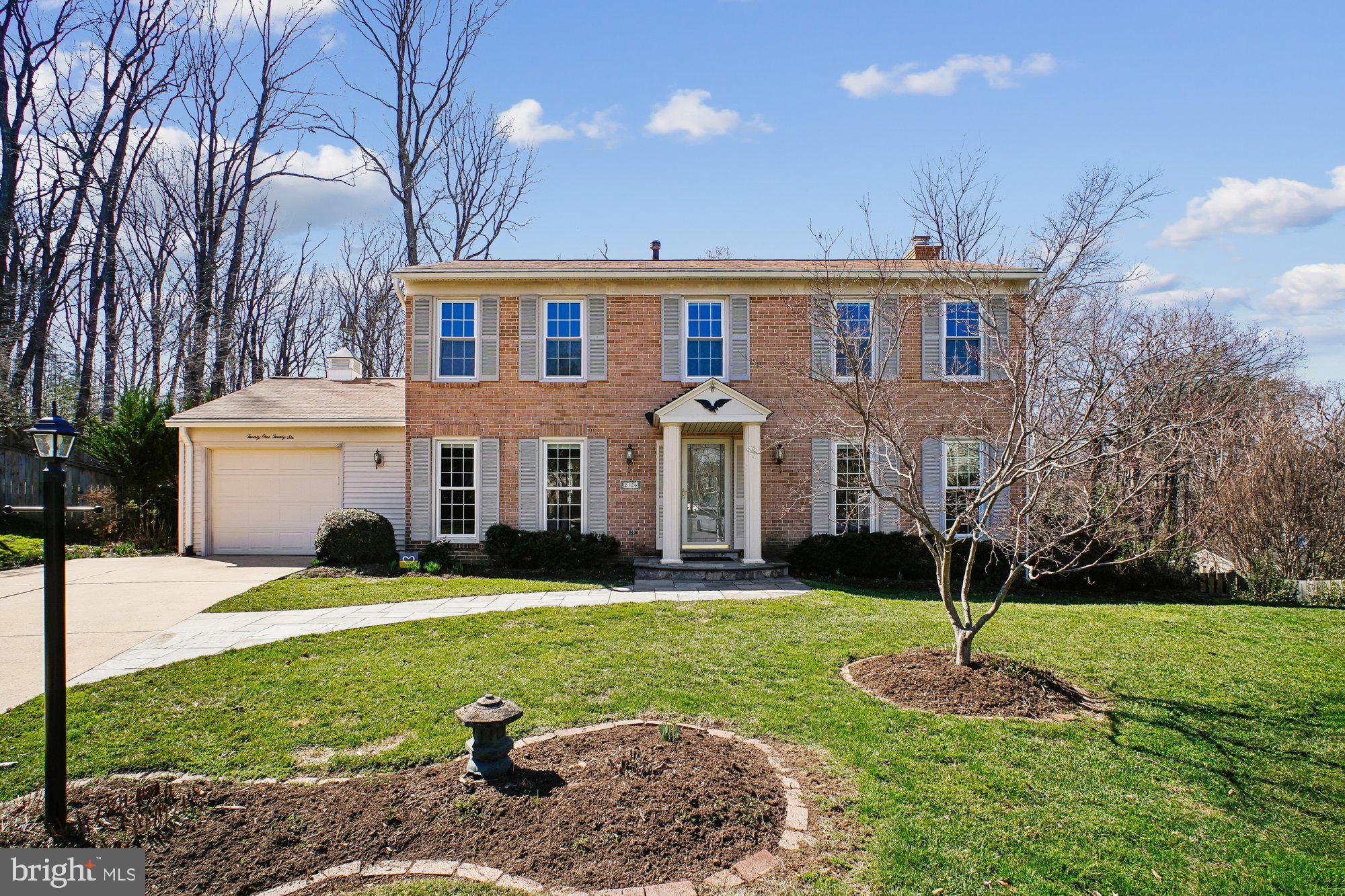 2126 Docket Lane Vienna, VA 22181 - Photo 57 of 63 a front view of a house with a yard