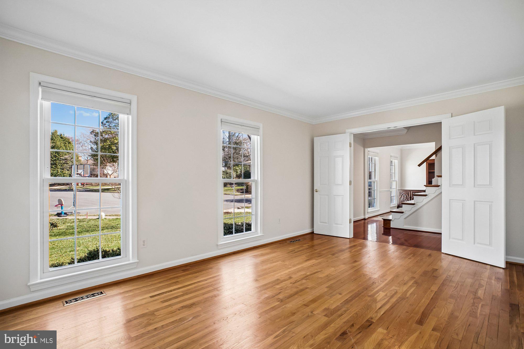 2126 Docket Lane Vienna, VA 22181 - Photo 6 of 63 a view of empty room with wooden floor and fan