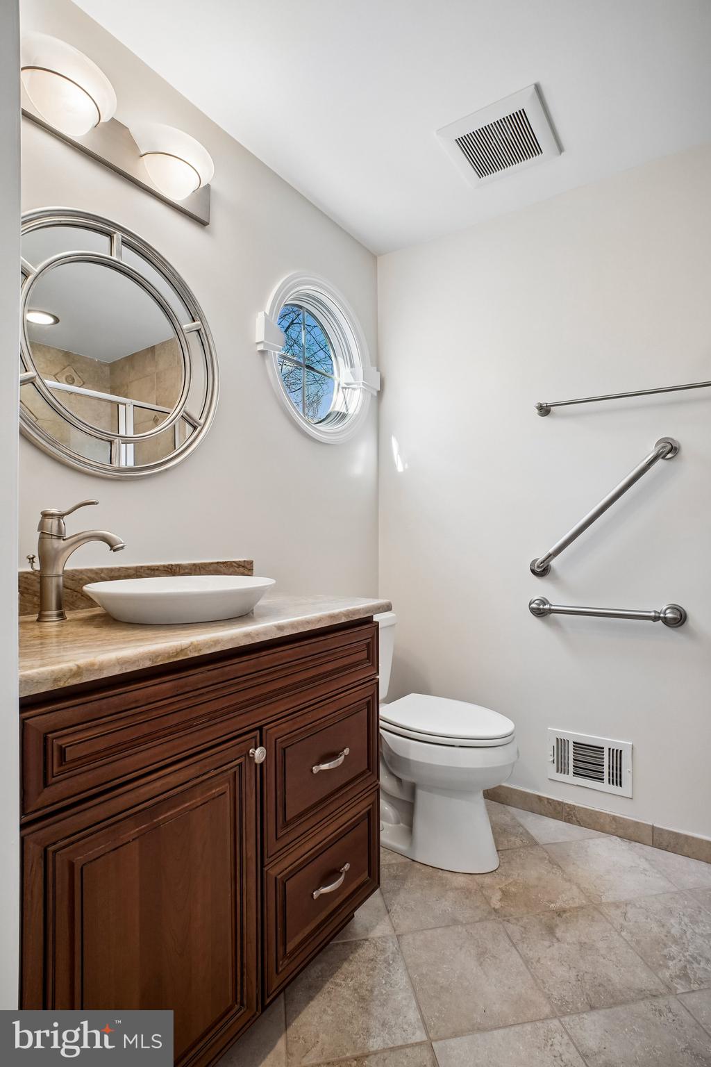 2126 Docket Lane Vienna, VA 22181 - Photo 7 of 63 a bathroom with a toilet and a sink