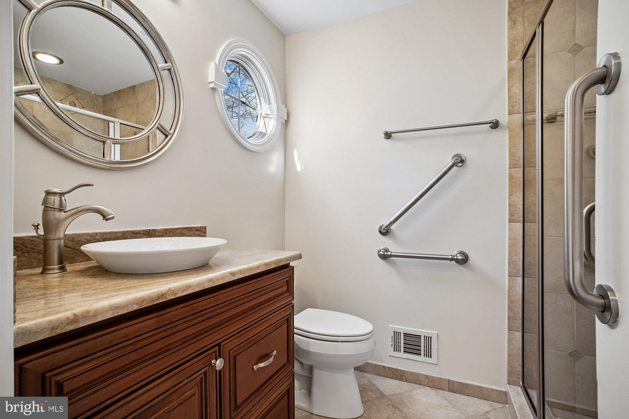 2126 Docket Lane Vienna, VA 22181 - Photo 8 of 63 a bathroom with a granite countertop toilet and a sink