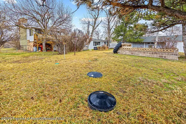 a view of outdoor space with garden and trees