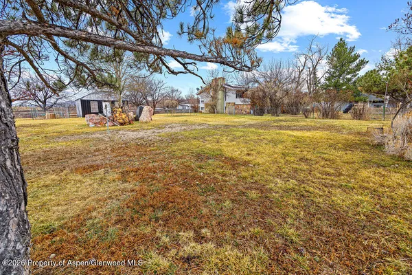 a view of a swimming pool with an outdoor space and seating area