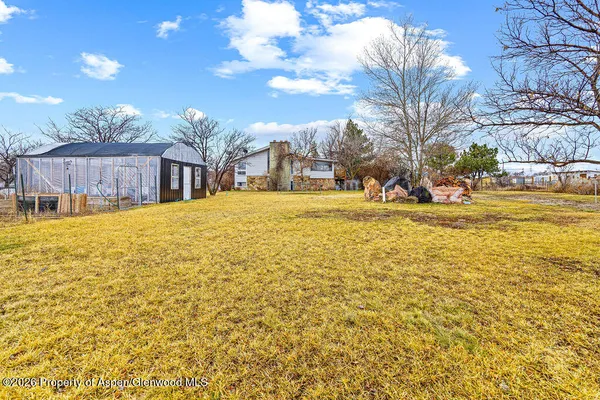 a swimming pool with outdoor seating and yard