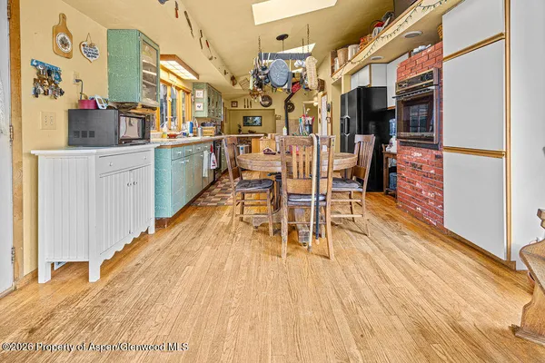 a kitchen with granite countertop a stove and a sink