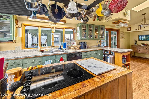 a living room filled with furniture and a large window
